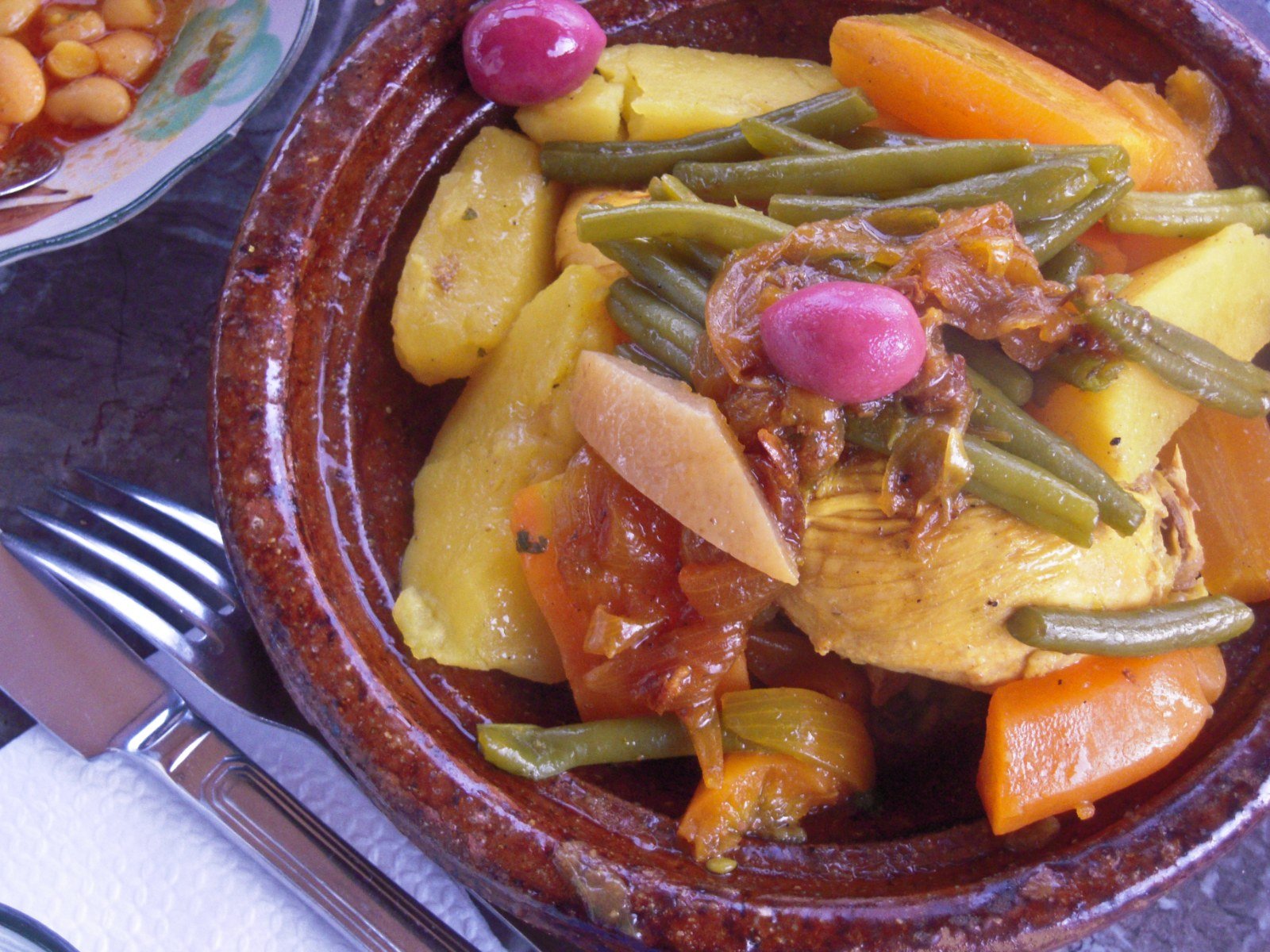 What to Eat in Northern Morocco: A Local's Guide to the Food That Matters (2026) Traditional Moroccan food — tajine and mint tea served at a local restaurant
