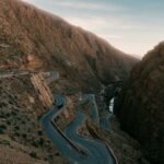 Tangier Airport Transfer: Getting to the City, Chefchaouen & Beyond (2026 Guide) Winding mountain road through a canyon in northern Morocco