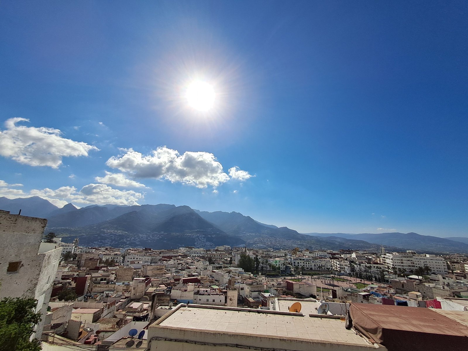One Day in Tétouan: Morocco's UNESCO Medina Everyone Skips (2026 Guide) The whitewashed UNESCO-listed medina of Tétouan, Morocco, with the Rif Mountains in the background