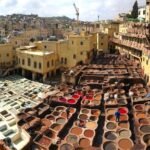 Fez Artisan Experiences: Rug Weaving, Wool Workshops & the Craft Souks (2026) Artisan craftsmanship in the medina of Fes, Morocco