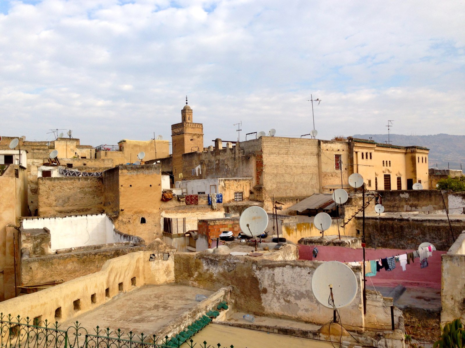 2 or 3 Days in Fes: What to Do, Where to Eat & How to Arrive (2026 Guide) Rooftop panorama of the Fes el-Bali medina, Morocco, with a minaret rising above the terraces
