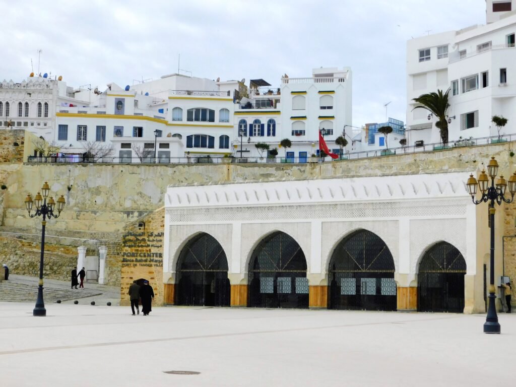 Where to Stay in Tangier: The Honest Area-by-Area Guide (2026) The Kasbah square in Tangier, Morocco, with its white walls and archways, one of the areas where visitors choose to stay