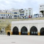 The Kasbah square in Tangier, Morocco, with its white walls and archways, one of the areas where visitors choose to stay